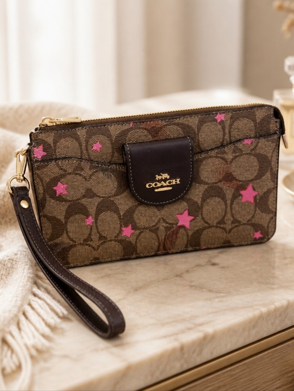 COACH Brown Signature Canvas Wristlet with Pink Star Print